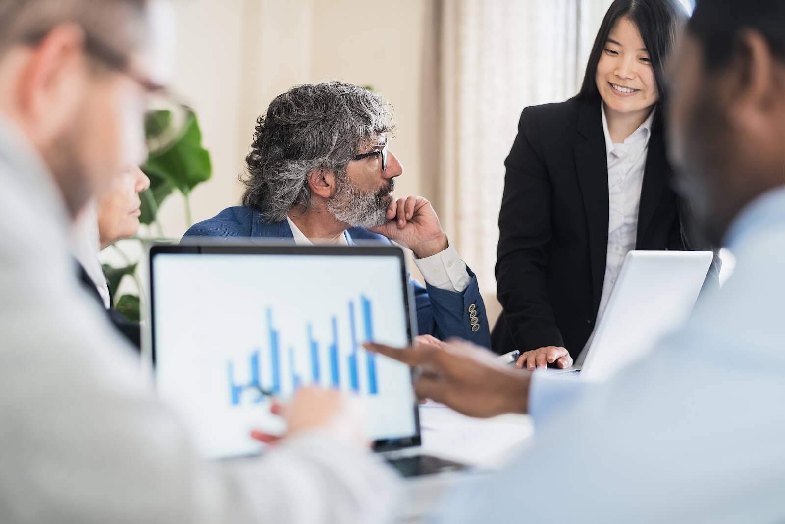 Business team discussing customer engagement analytics and performance data during a meeting